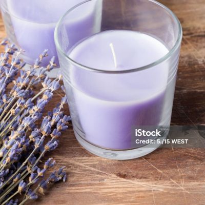 Dry lavender flowers and candle lavender color